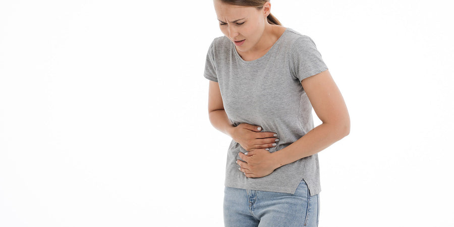 woman holding stomach digestion problems